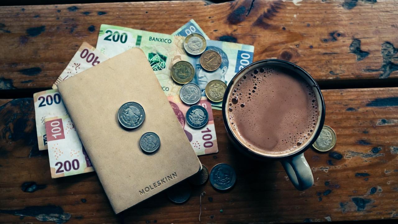 A pile of silver Mexican peso coins