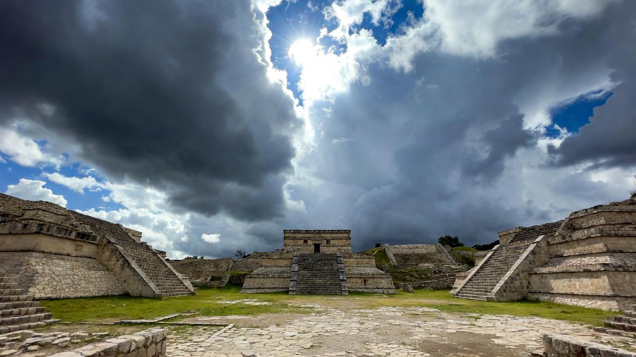 Ancient stone structure under a bright blue sky