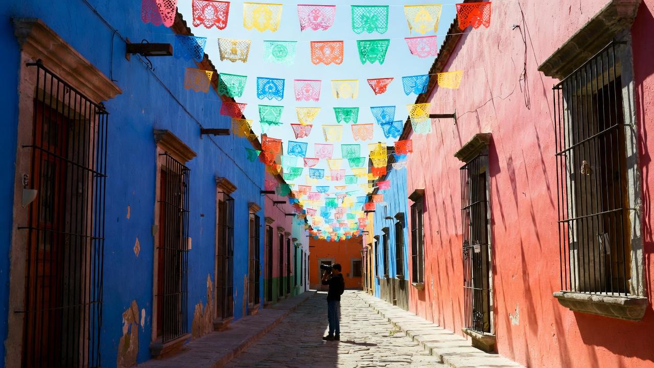 A white and blue church with a vivid blue roof in Oaxaca
